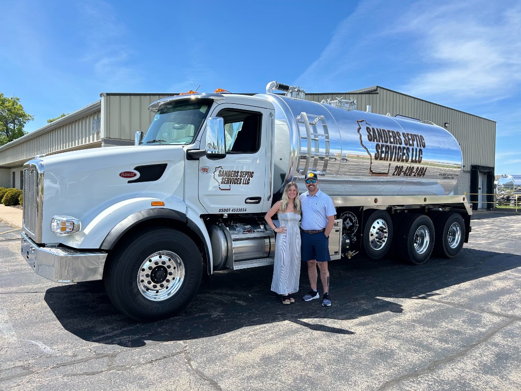 Owners of Sanders Septic Services with their pump truck in Hawthorne, WI
