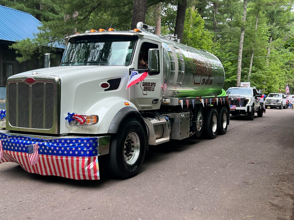 Sanders Septic Services truck in a local community parade